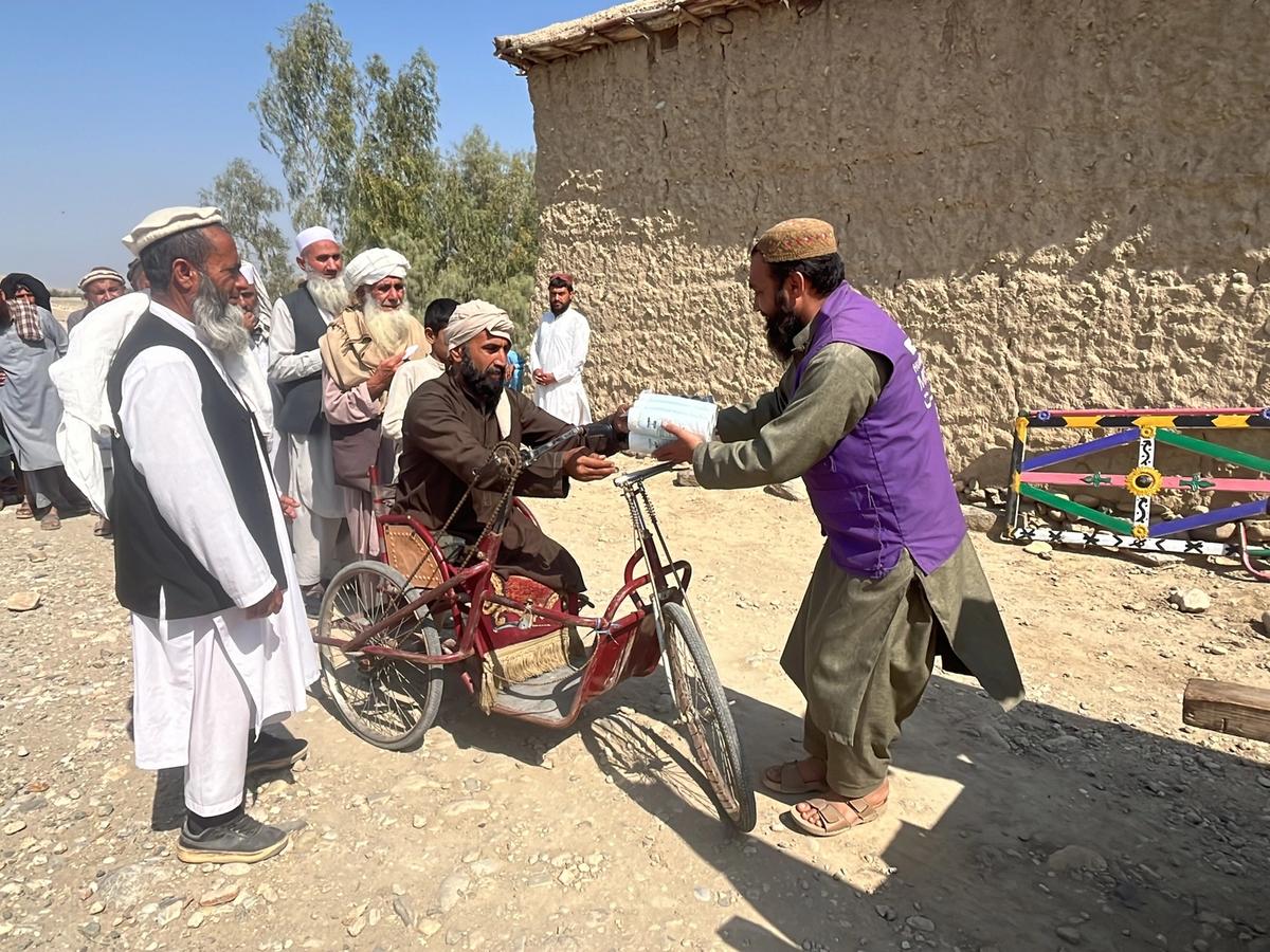 A disabled Afghan person receiving a hygiene kit | Human Relief Mission