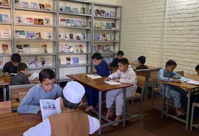 Children Reading Books in Afghanistan Library | Human Relief Mission