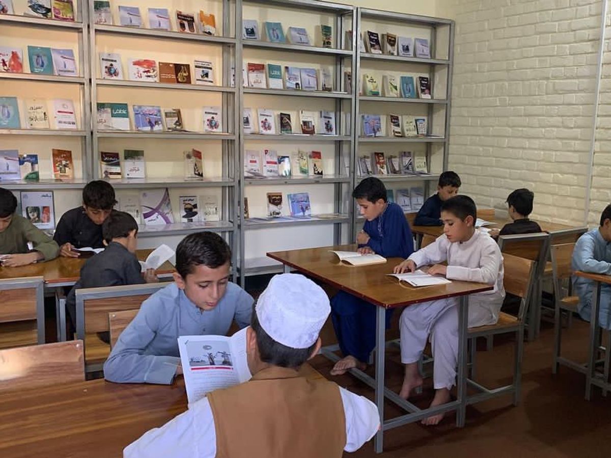 Afghanistan Orphanage Library with Students Reading | Human Relief Mission