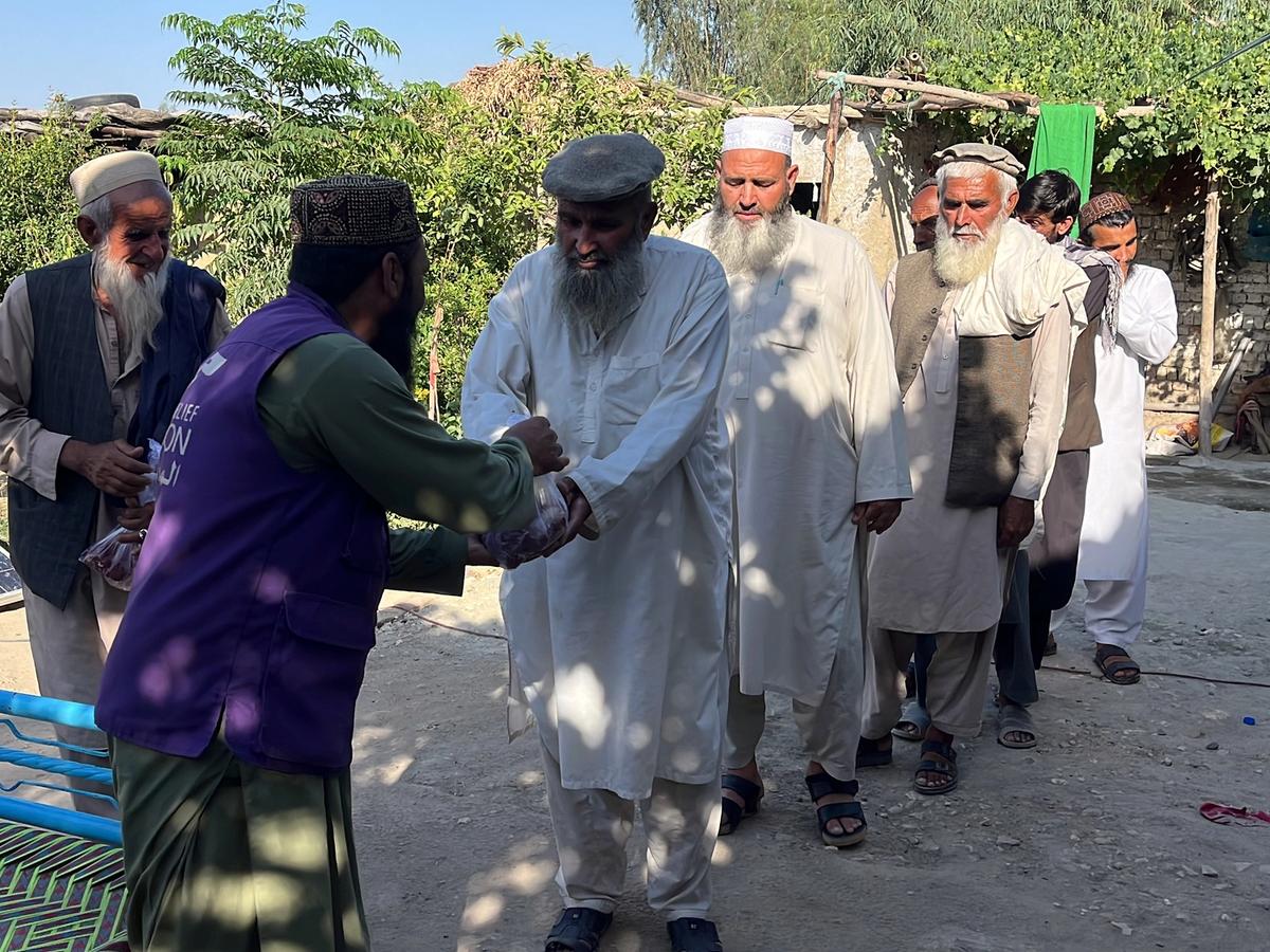 HRM Charity Aid Worker Distributing fresh meat to the locals in Afghanistan | Human Relief Mission