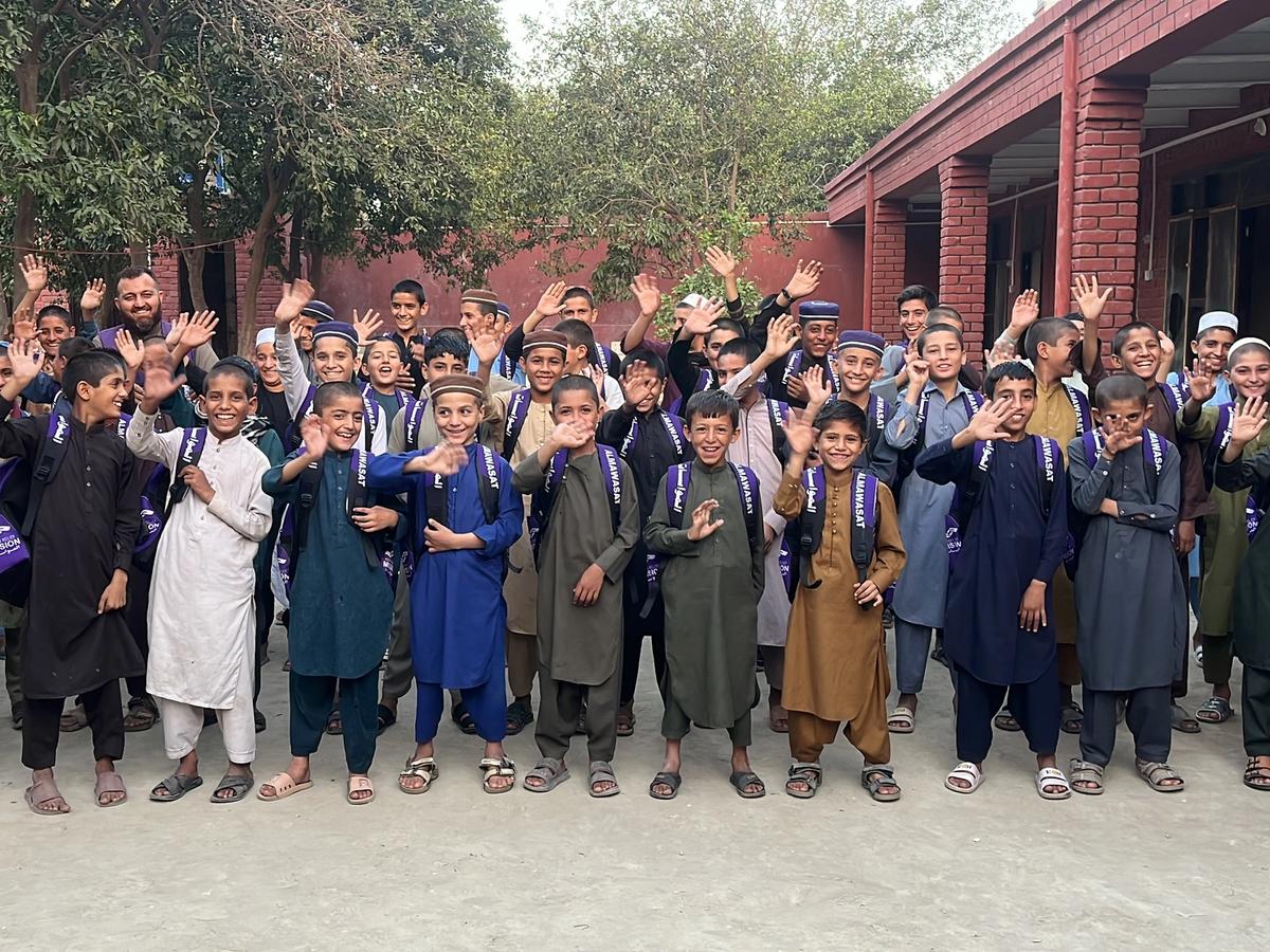 Children Waving Outside an Orphanage in Afghanistan Students Waving Outside an Orphanage in Afghanistan | Human Relief Mission