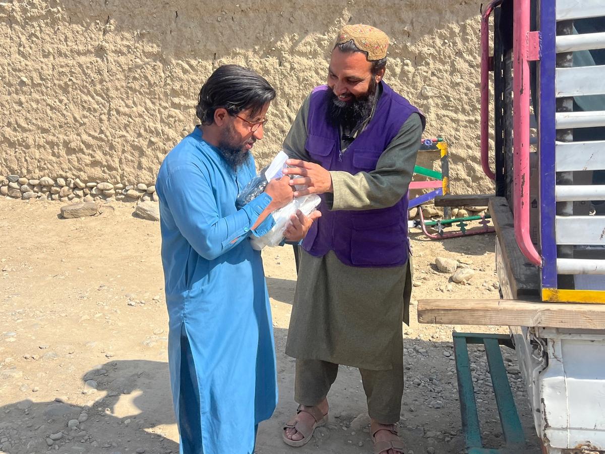 A man in Afghanistan receiving a hygiene kit from HRM's Aid Worker | Human Relief Mission