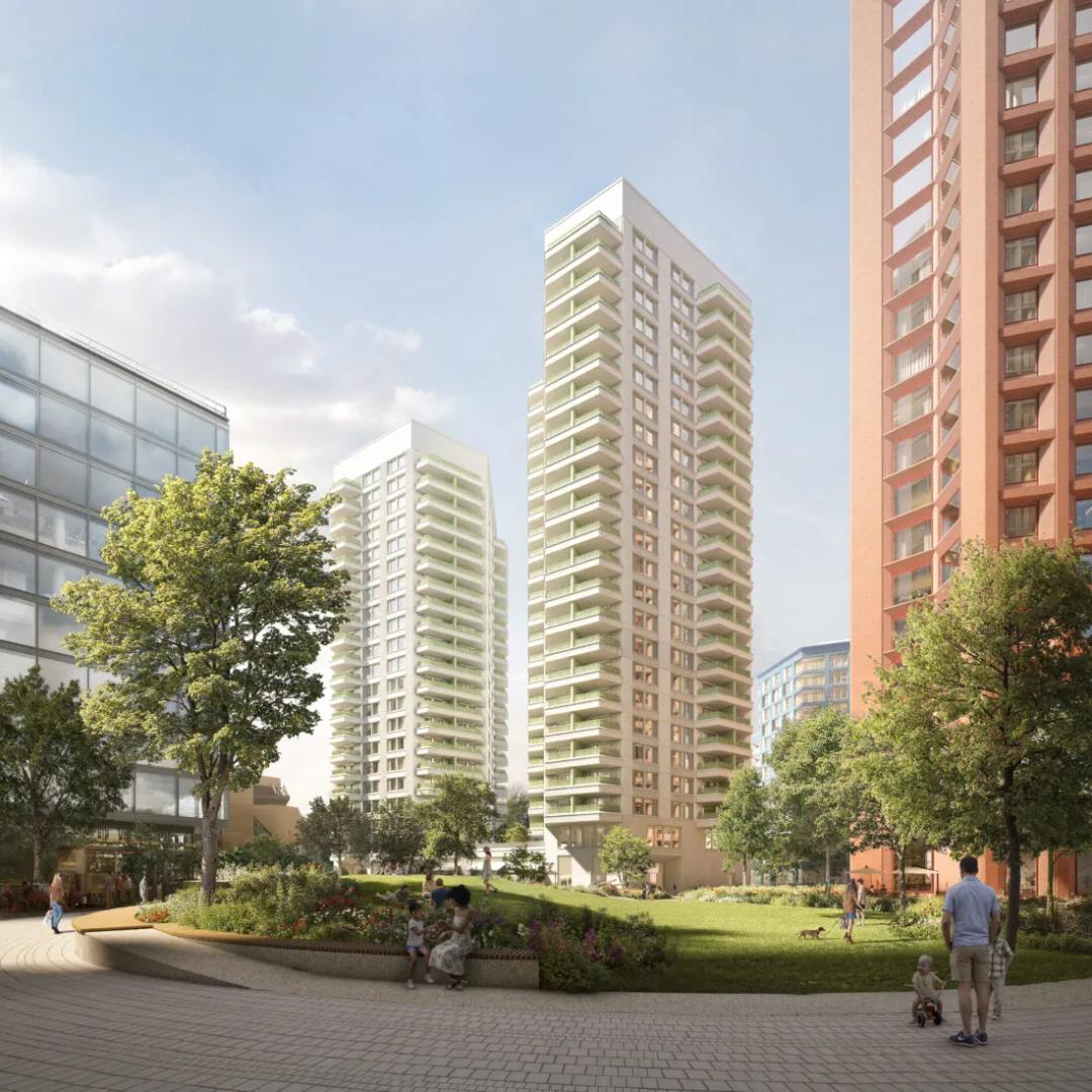 Architectural render showing five tall residential towers clustered near Stratford station, with the green expanse of the Olympic Park visible in the background and lower-rise urban development surrounding the base of the buildings.