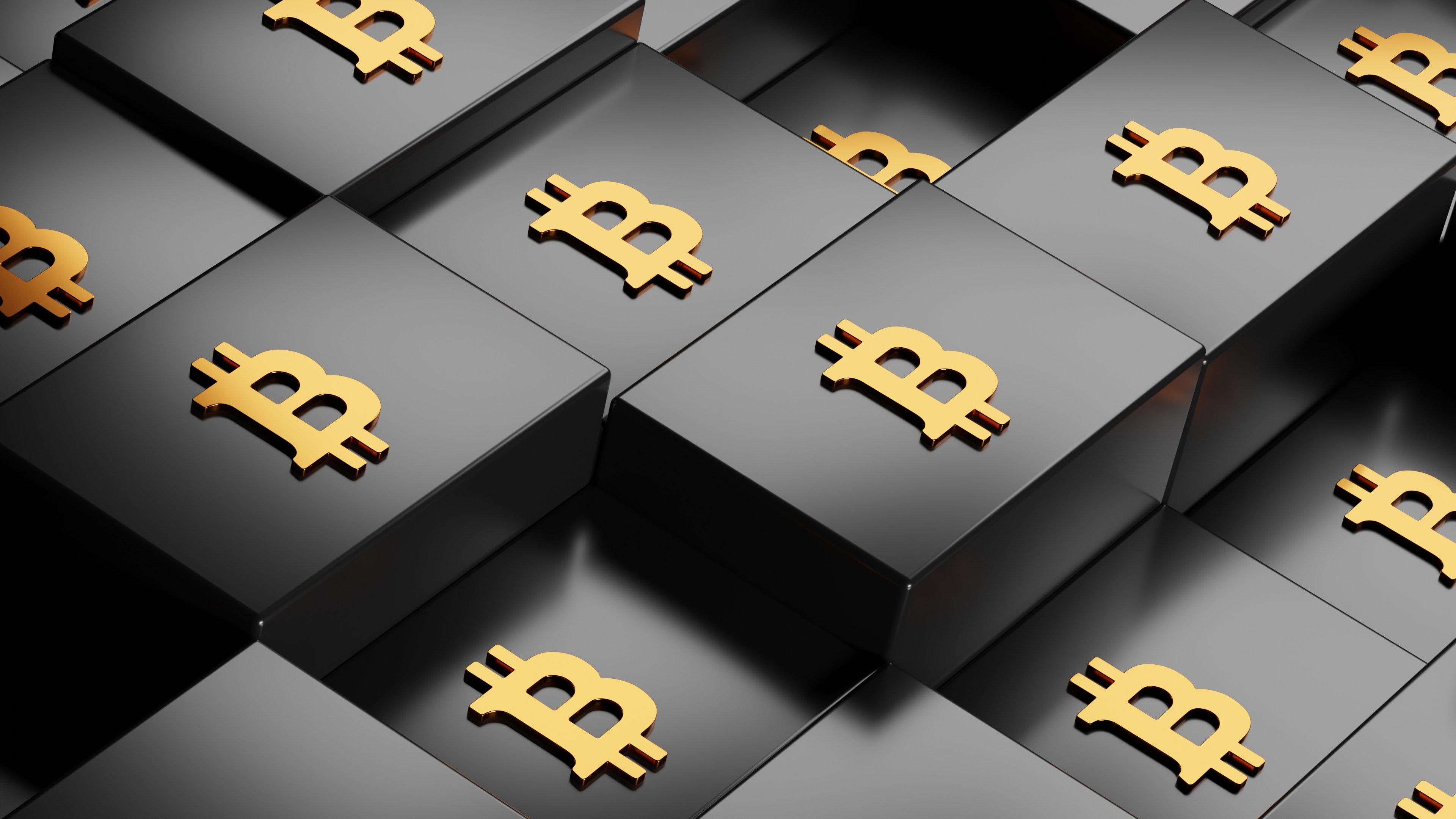 Bitcoin symbols on black boxes.