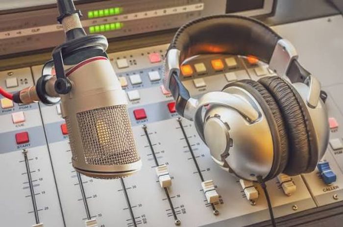 Broadcast microphone and headphones over a radio mixing console