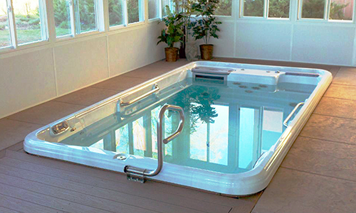 The TidalFit Swim Spa and Exercise Pool range offers more features than other swim pools on the market.  The TidalFit offers a choice of two different adjustable swim jets, both providing a variable swim current perfect for light and strong swimmers alike. The exercise element of the TidalFit does not end there, however, offering stretch bands, rowing equipment and a running tether too to provide the ultimate workout.



The TidalFit has a double hydrotherapy option to soothe your muscles after your workout.  Featuring a variety of premium jets powered by Artesian’s patented DirectFlow™ technology, you really do get the full water gym experience.
What’s more, with optional multicolour LED lighting, powerful sound systems and Artesian’s Crystal ProPure Ozone chamber, your TidalFit spa becomes a relaxation and entertainment hub once the exercise is over.

NEW – The Semi-in-ground TidalFit allows you to sink the spa halfway into the ground whilst still allowing access to all the equipment, offering a unique, unimposing swim spa option.

For more information, please visit [https://www.artesianspas.co.uk/range/tidalfit-swim-spas/](url)