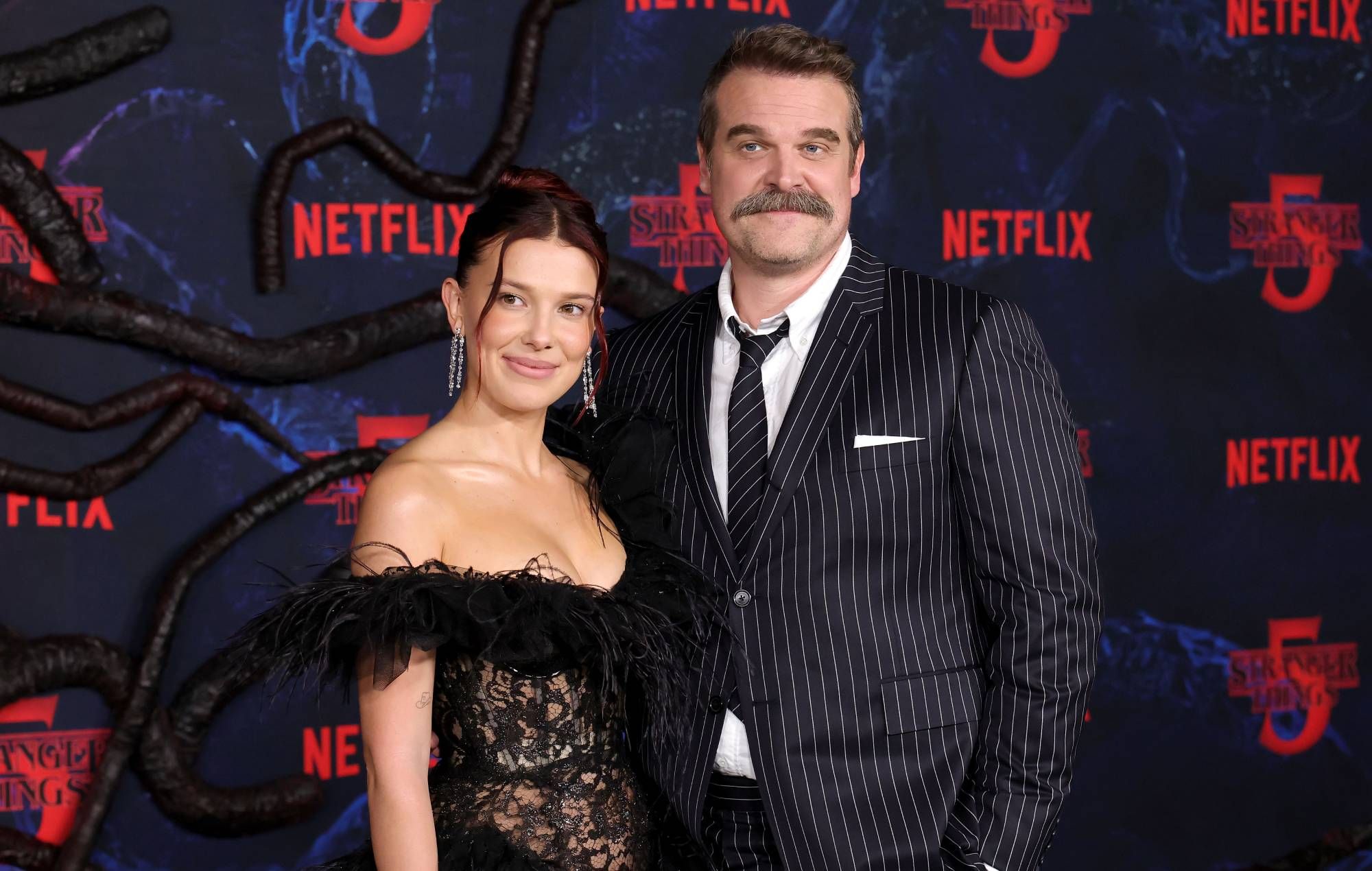 David Harbour says he and Millie Bobby Brown "still adore each other" after harassment allegations as they both speak out — News story on dripviewz