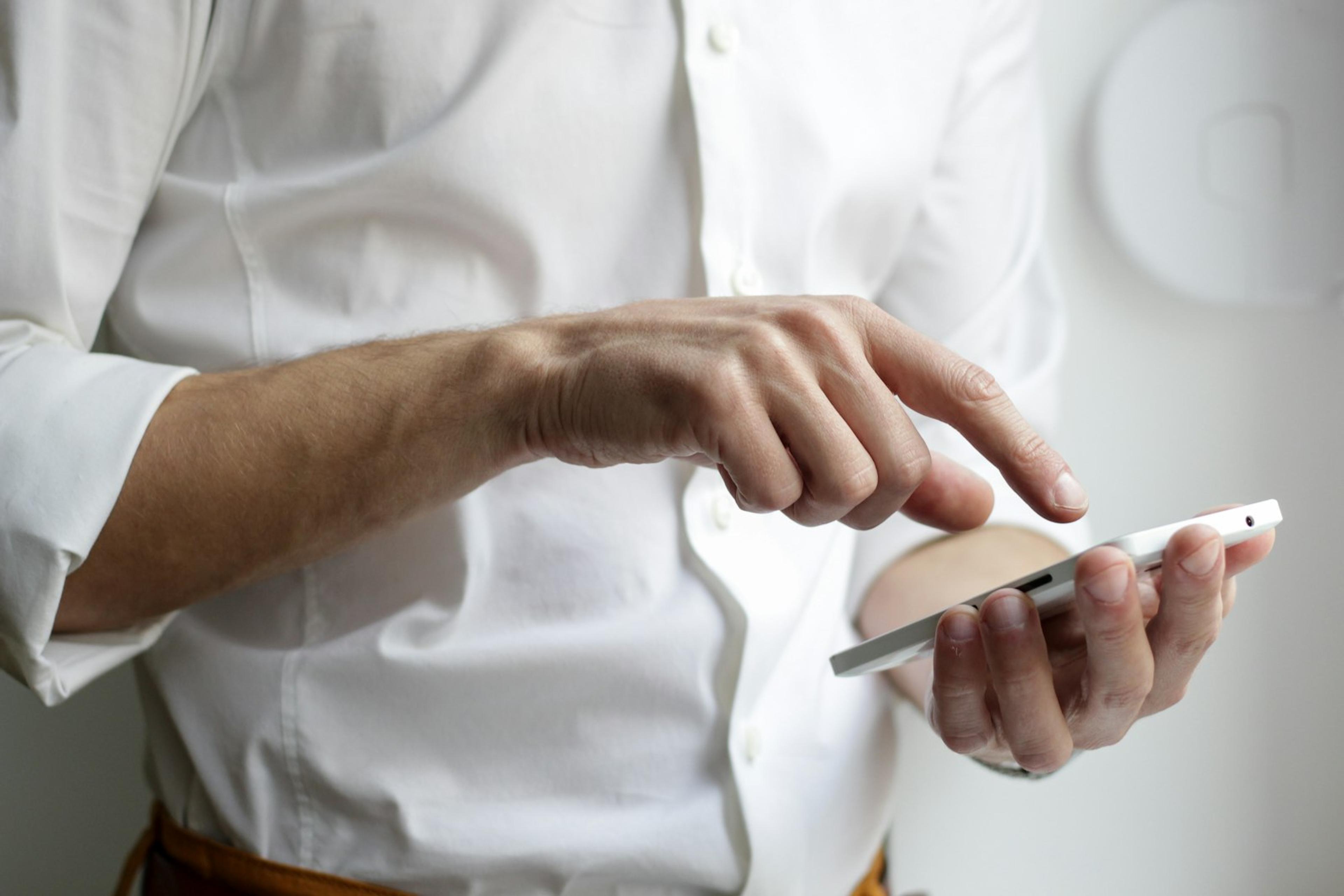 Person holding and using a mobile app on a smartphone