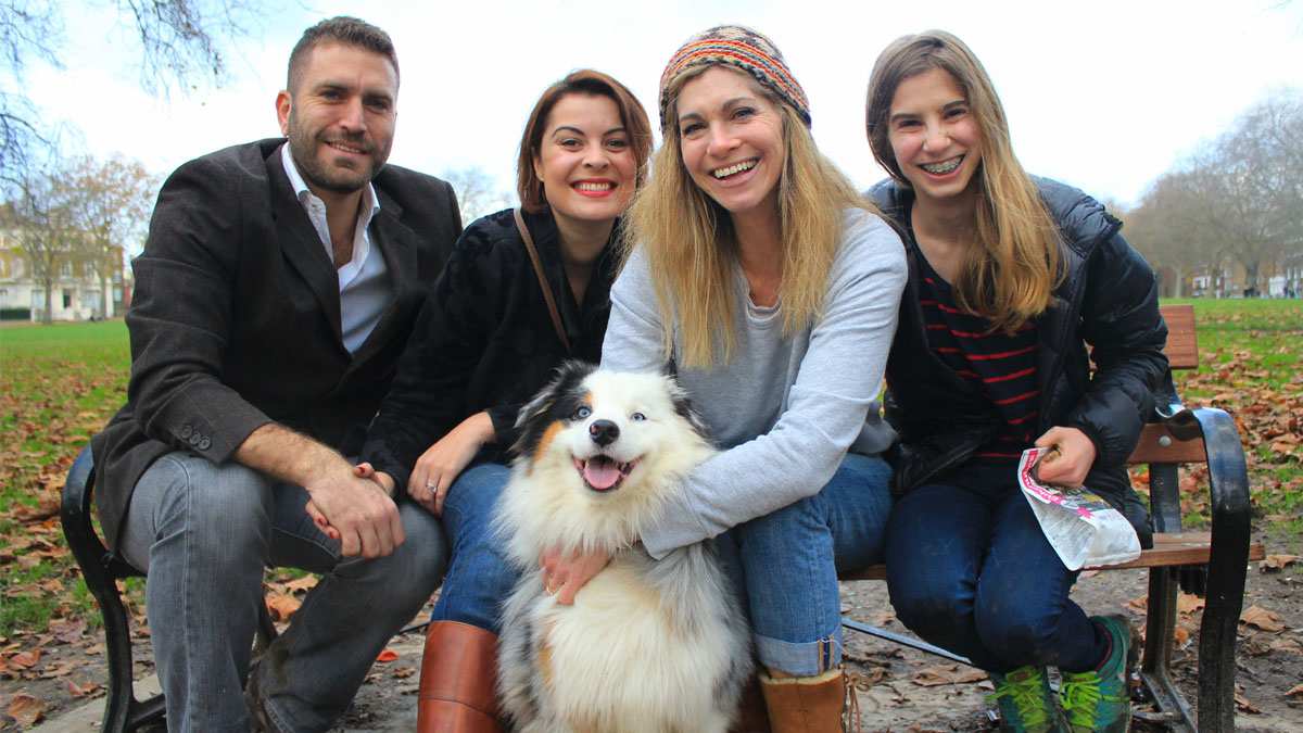 Posey, the Australian Shepherd, with her dog owners and dog sitters