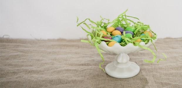 synthetic Easter grass in a bowl full of little easter eggs