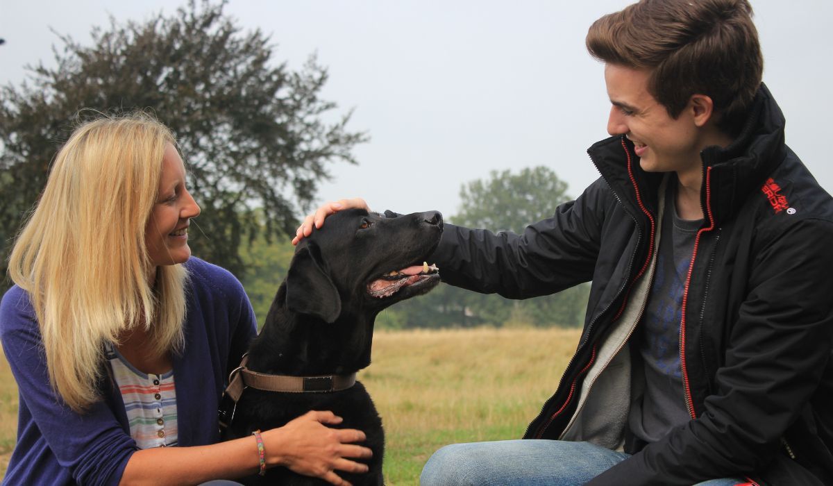 Doggy Member Oso, with owner Anna and borrower Michael enjoying a fuss