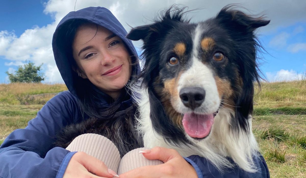 Doggy member Shep, the Border Collie, and their human looking very happy at the camera