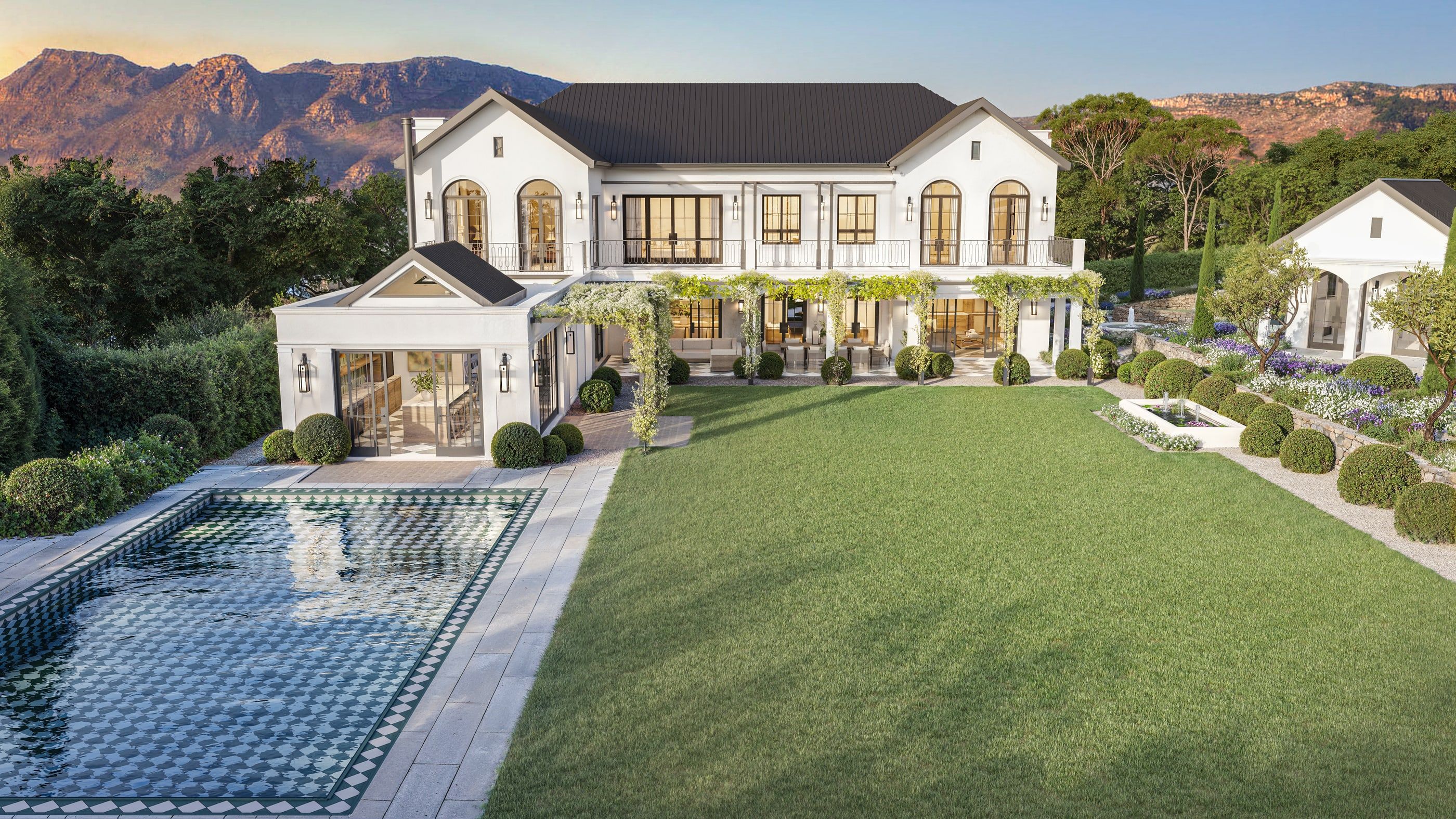 Sunkiss: the house, its pool and lawn, with the Constantia mountains behind