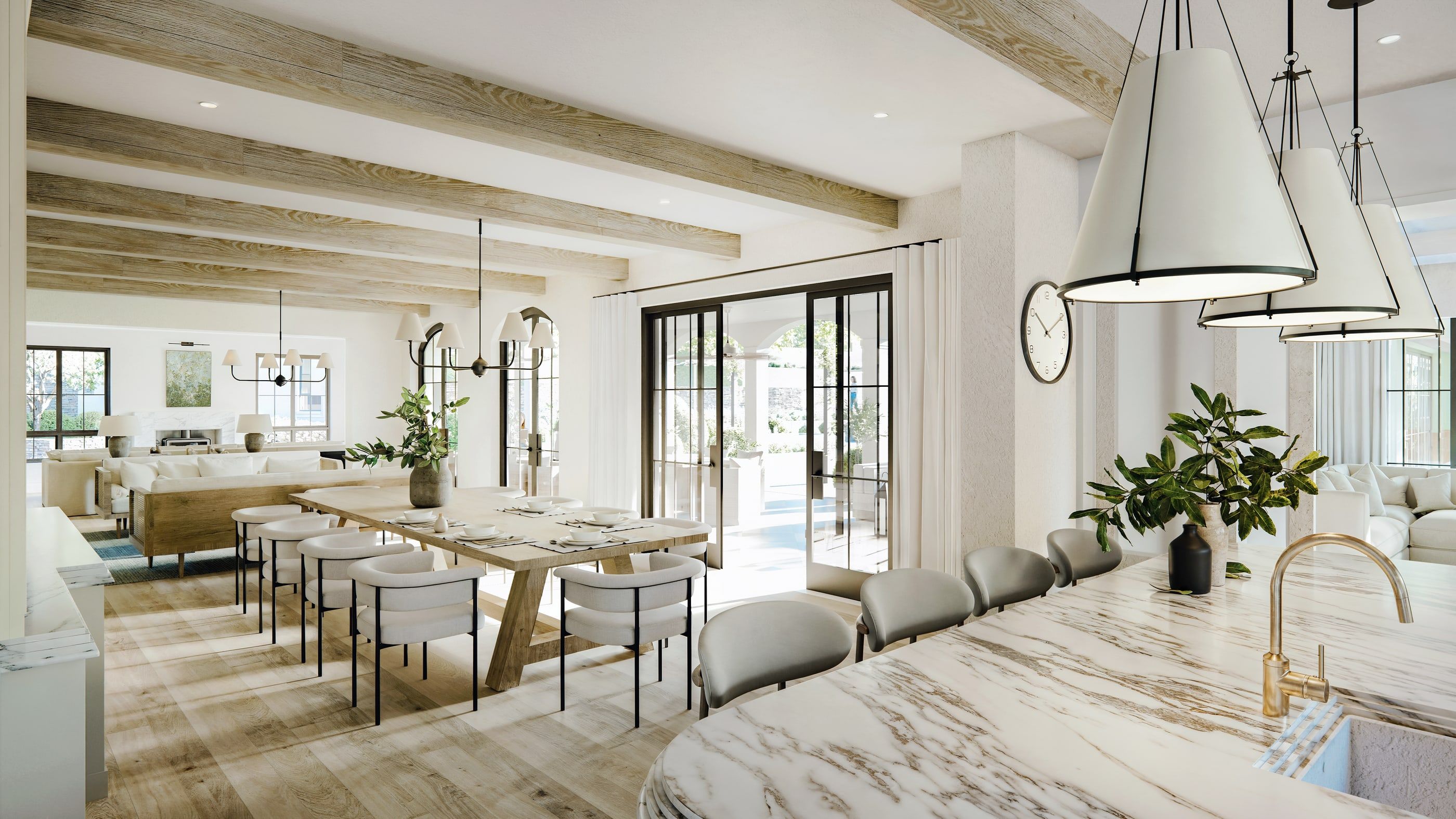 The kitchen and living area at Sunkiss, with beamed ceilings and a marble island