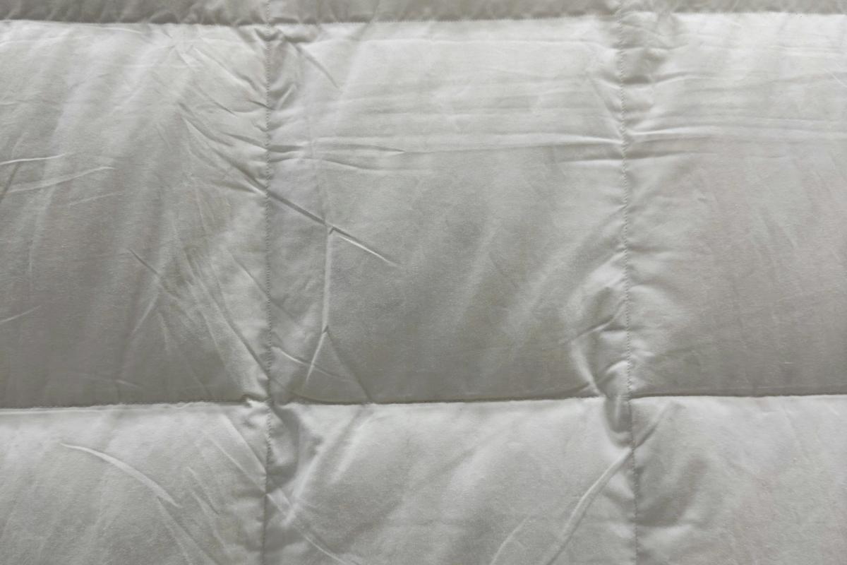 Close-up of a white quilted hotel duvet