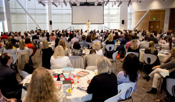 A wide shot of a TVCFO conference