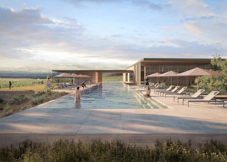 A rendering of an infinity pool in front of a low-slung modern building, at dusk
