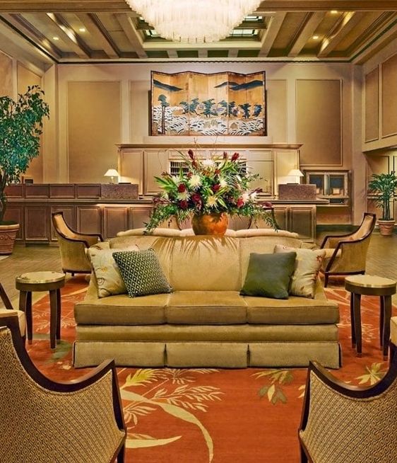 Lobby at the Mayflower Park Hotel featuring comfy couches and large rugs. 