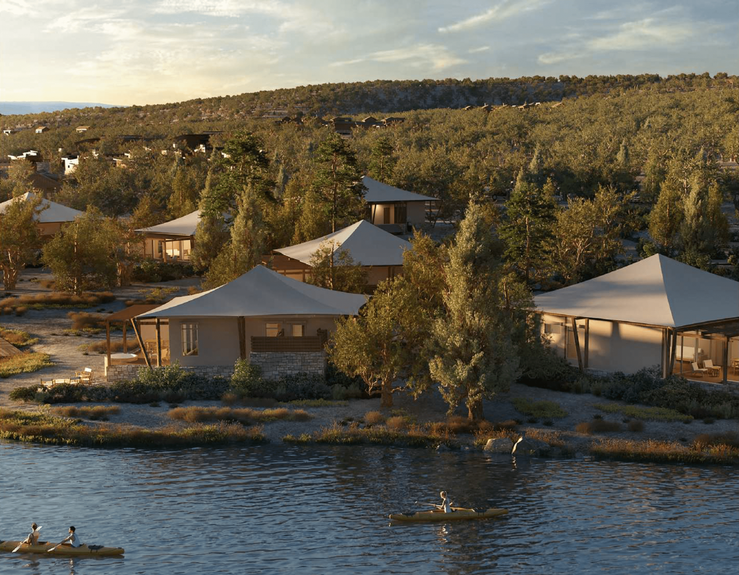 Tent cabins situated alongside a picturesque lake.