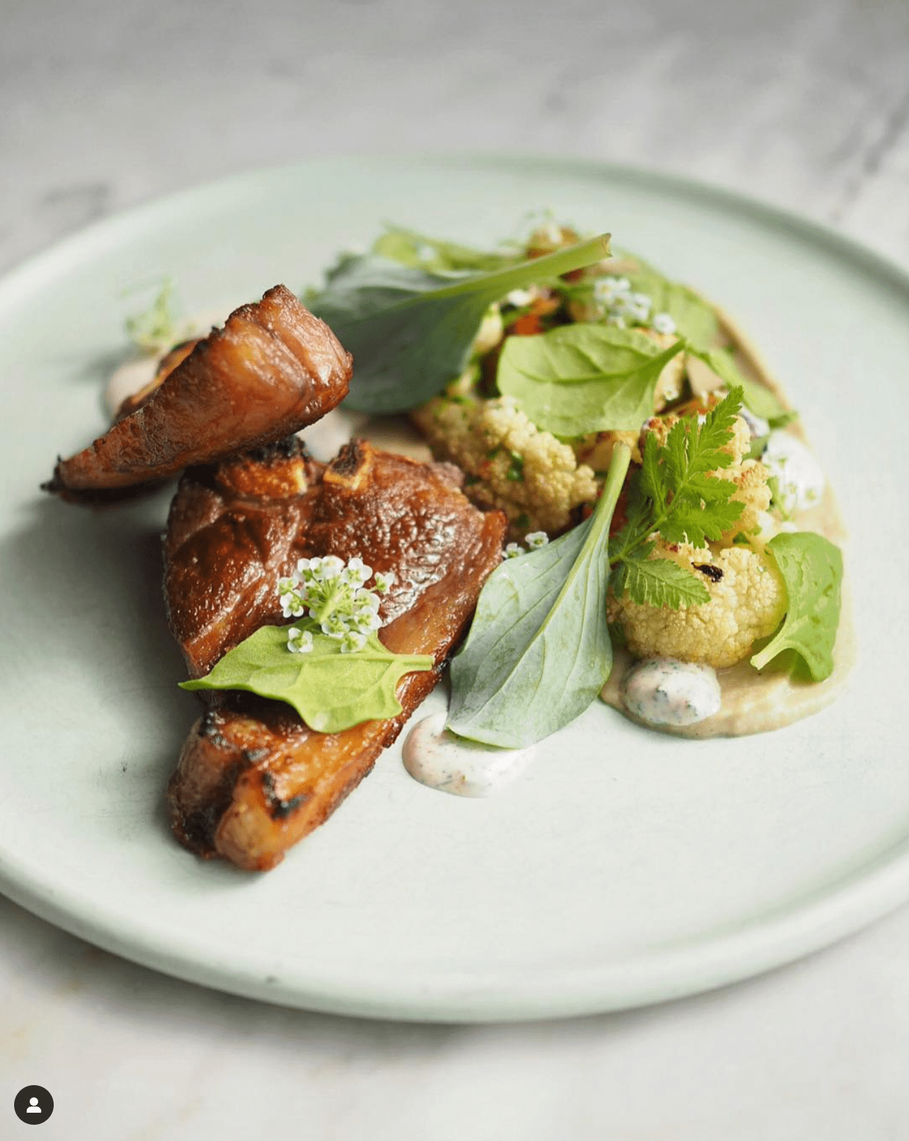 A appealing composition of food on a plate. 