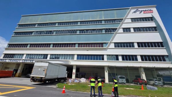 Drone inspecting the SingPost building facade