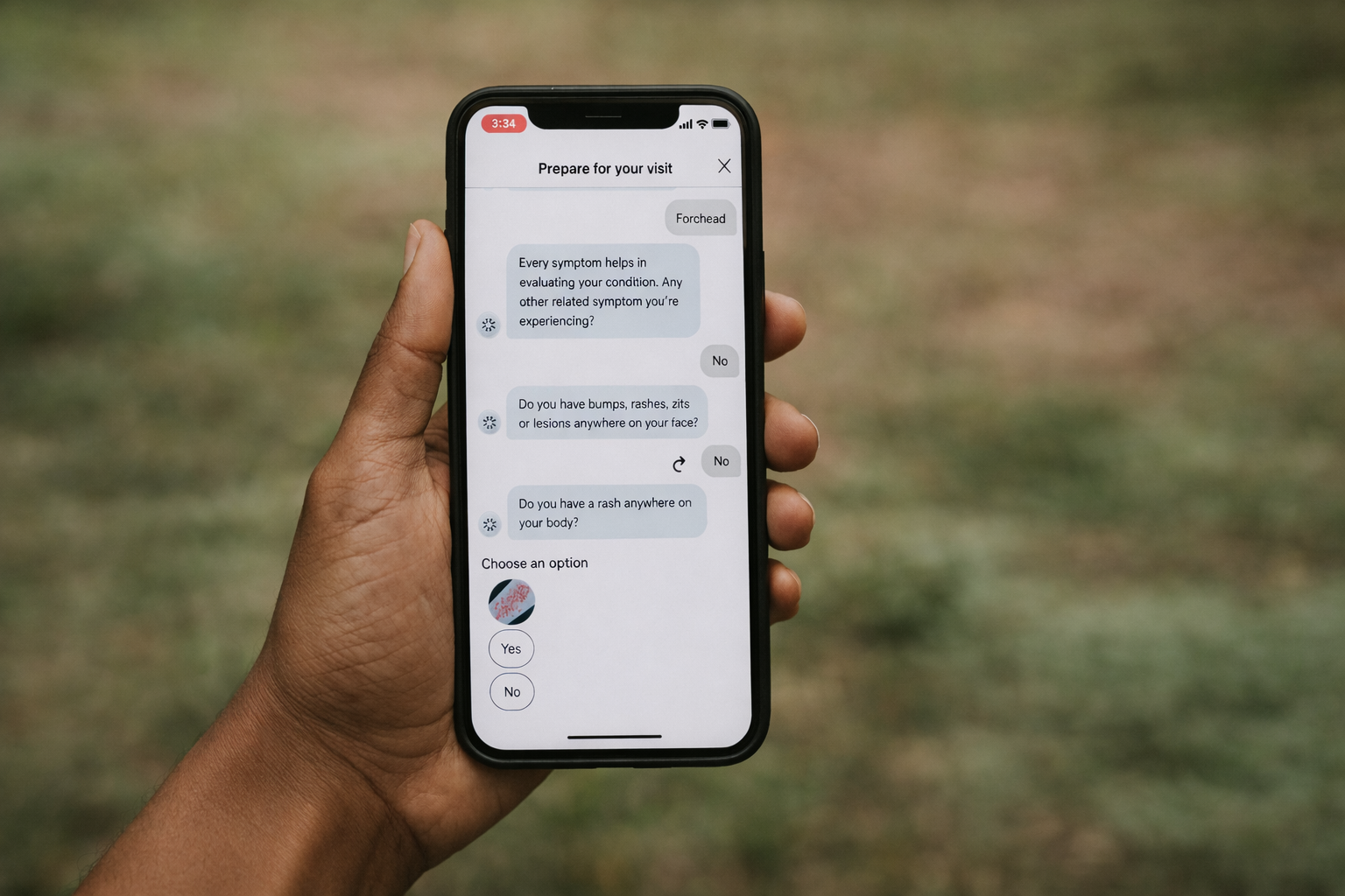 a man holding a phone showing the K Health Symptom Checker