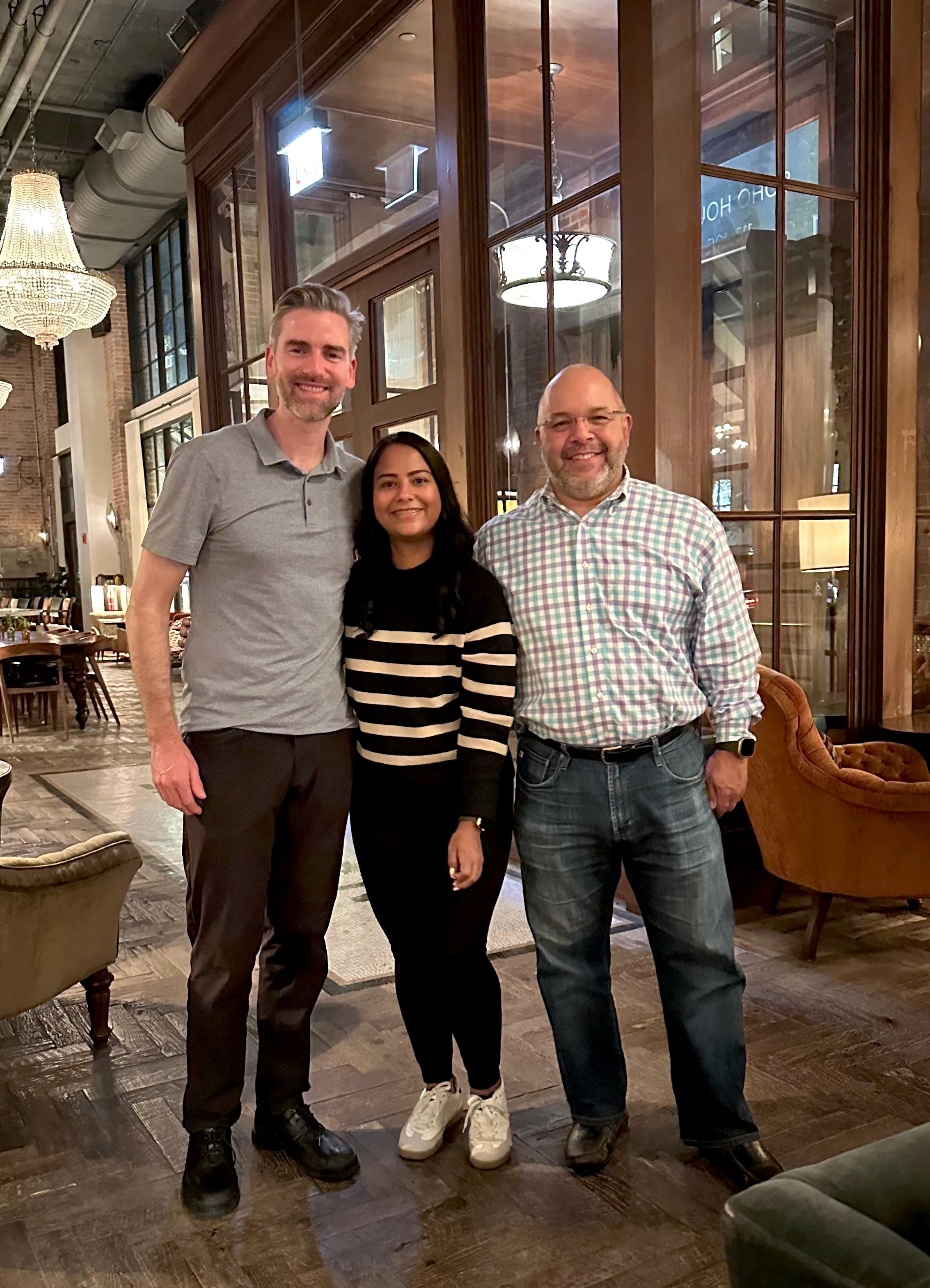 Rob Volk, Karina Lopez and Elliott Torres standing in a restaurant 