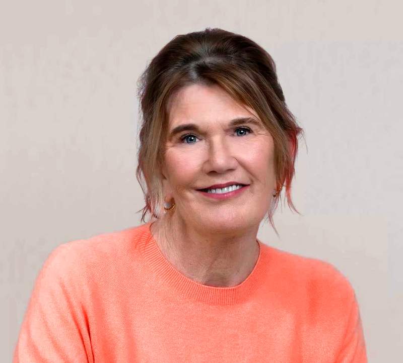 Katie Fizpatrick wearing a coral coloured jumper