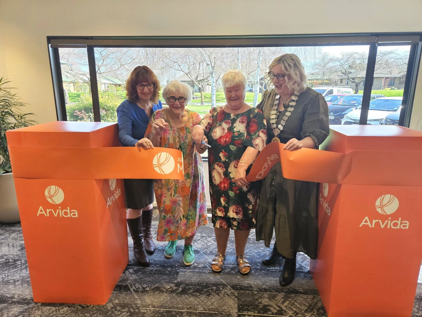 Four females cutting ribbon to celebrate 30 years of Mary Doyle