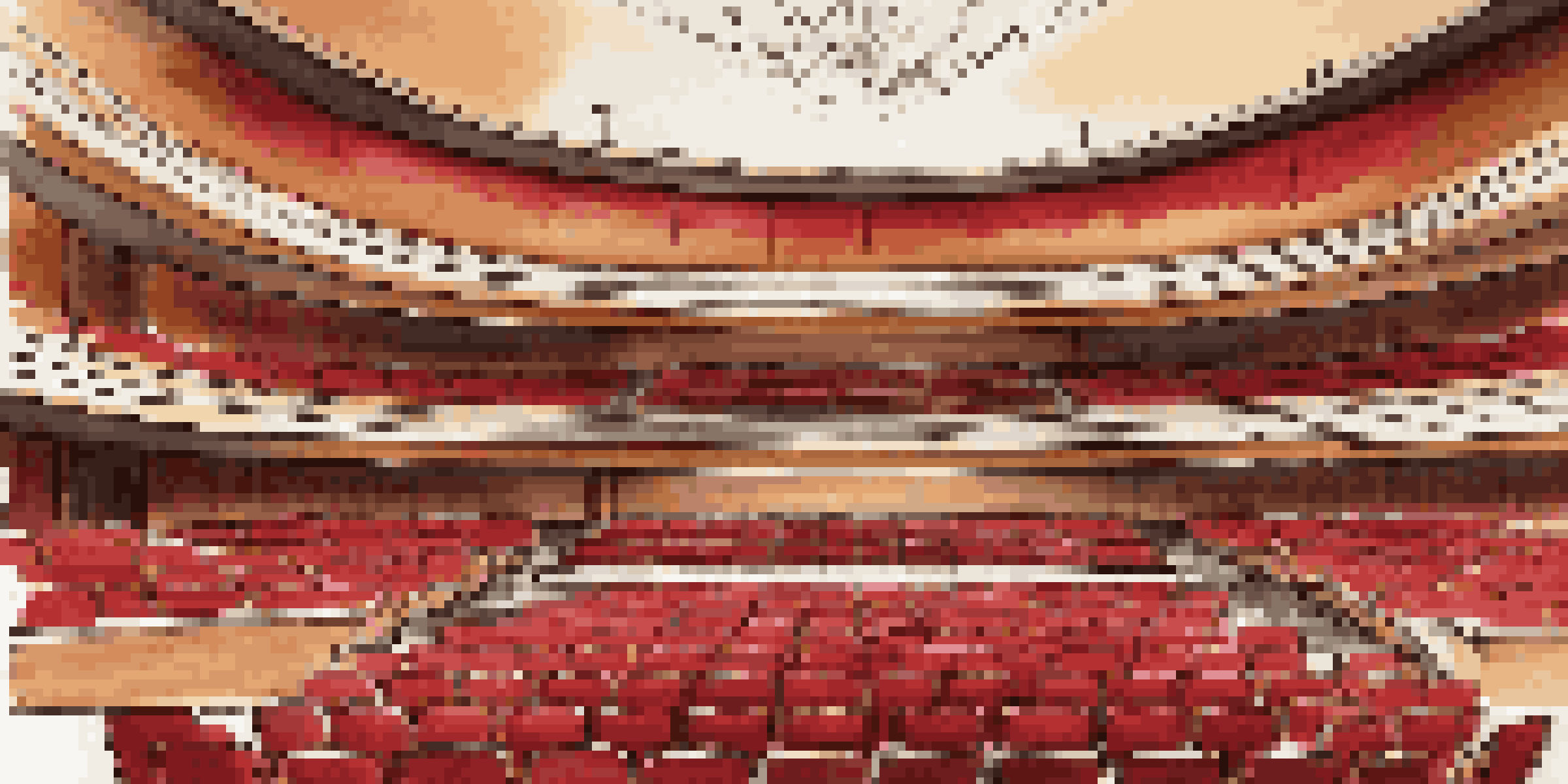Interior view of a concert hall with wooden paneling, red fabric seats, and soft lighting, illustrating sound waves flowing through the space.