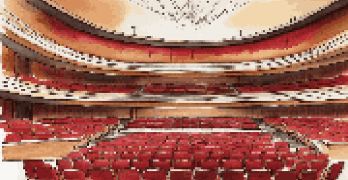 Interior view of a concert hall with wooden paneling, red fabric seats, and soft lighting, illustrating sound waves flowing through the space.