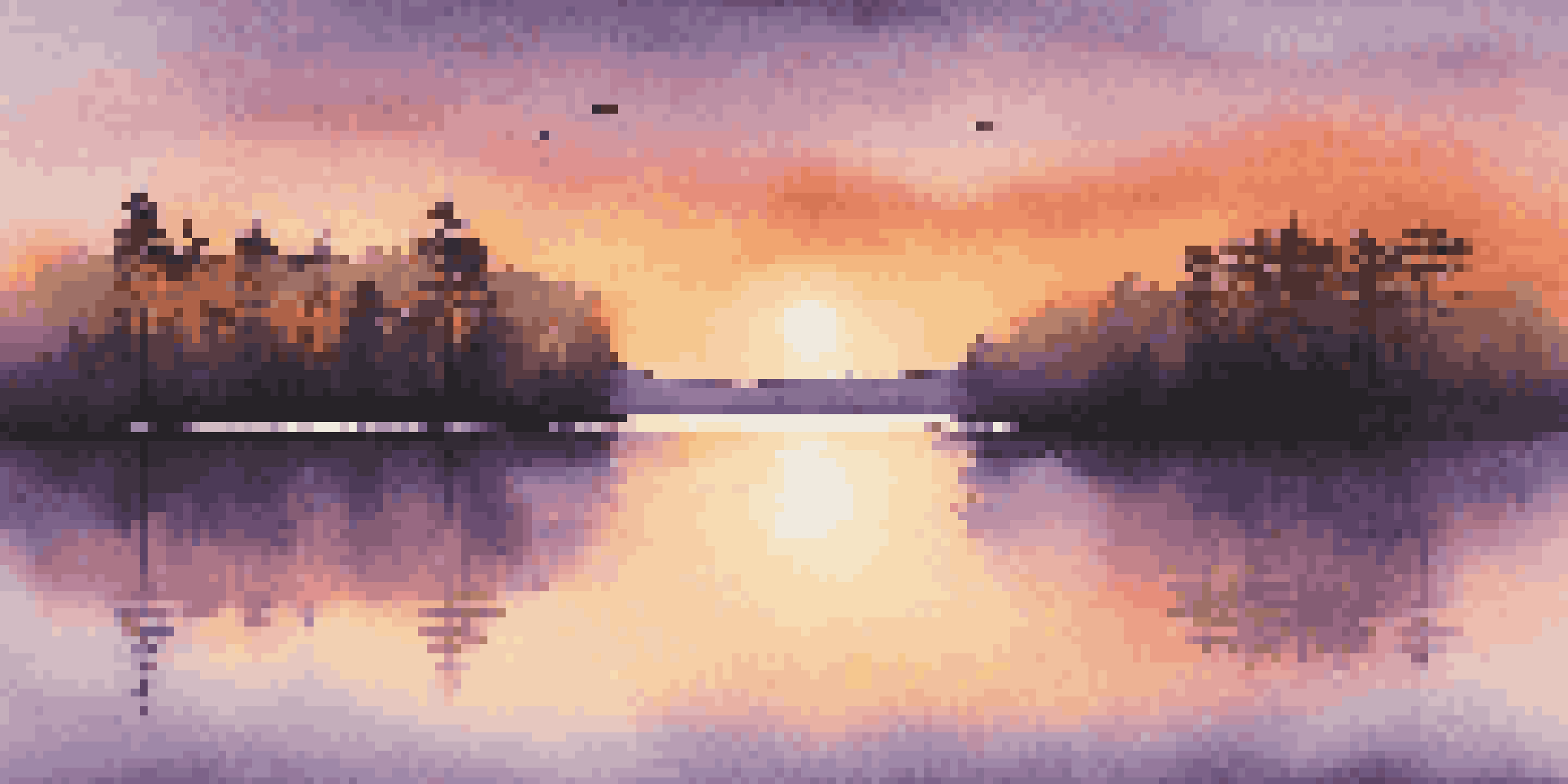 A beautiful sunset over a calm lake with silhouetted trees in the foreground, showcasing vibrant orange, pink, and purple colors in the sky.
