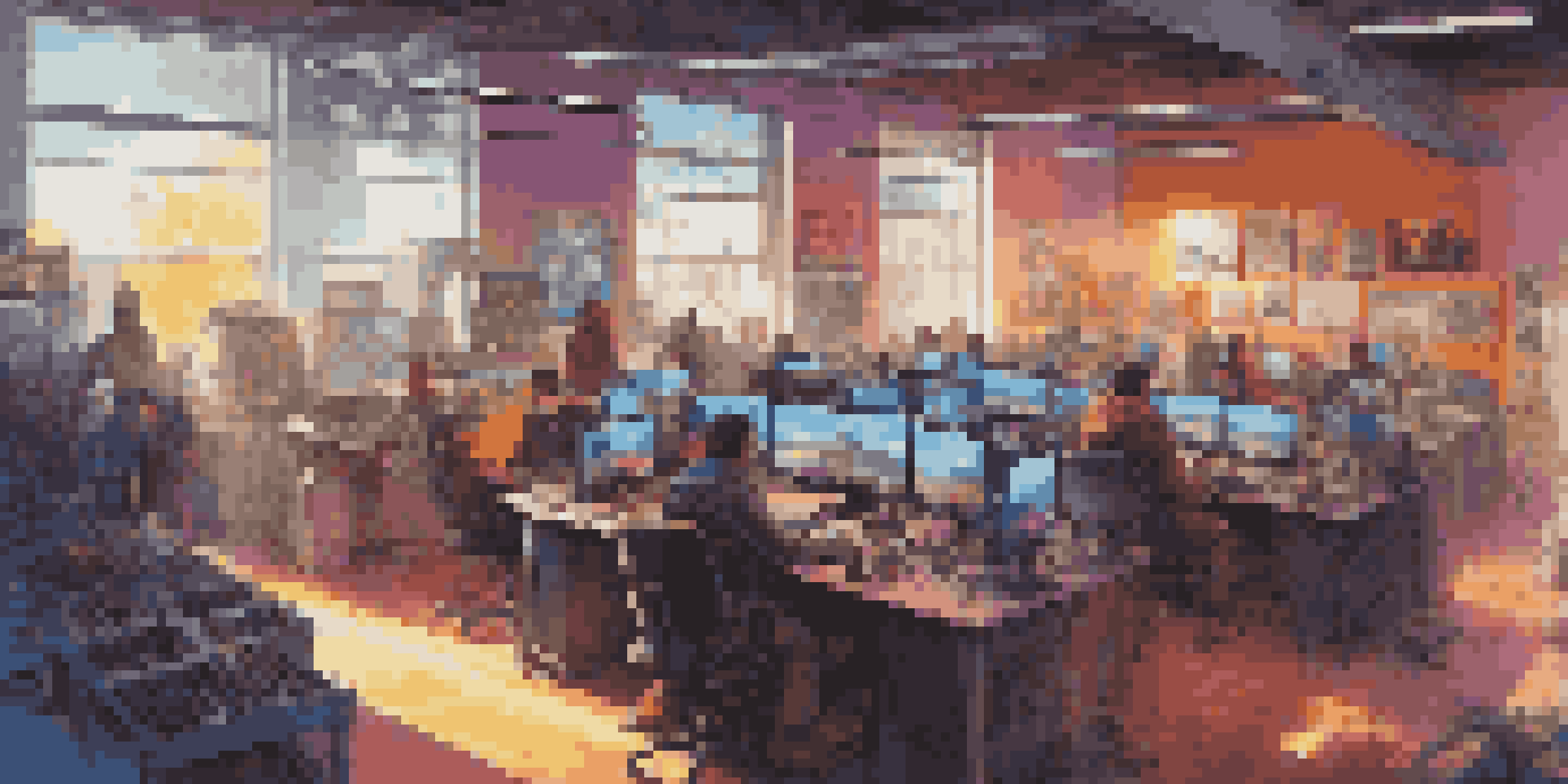 A busy video game development studio with diverse artists and sound designers working, adorned with gaming posters and colorful lights.