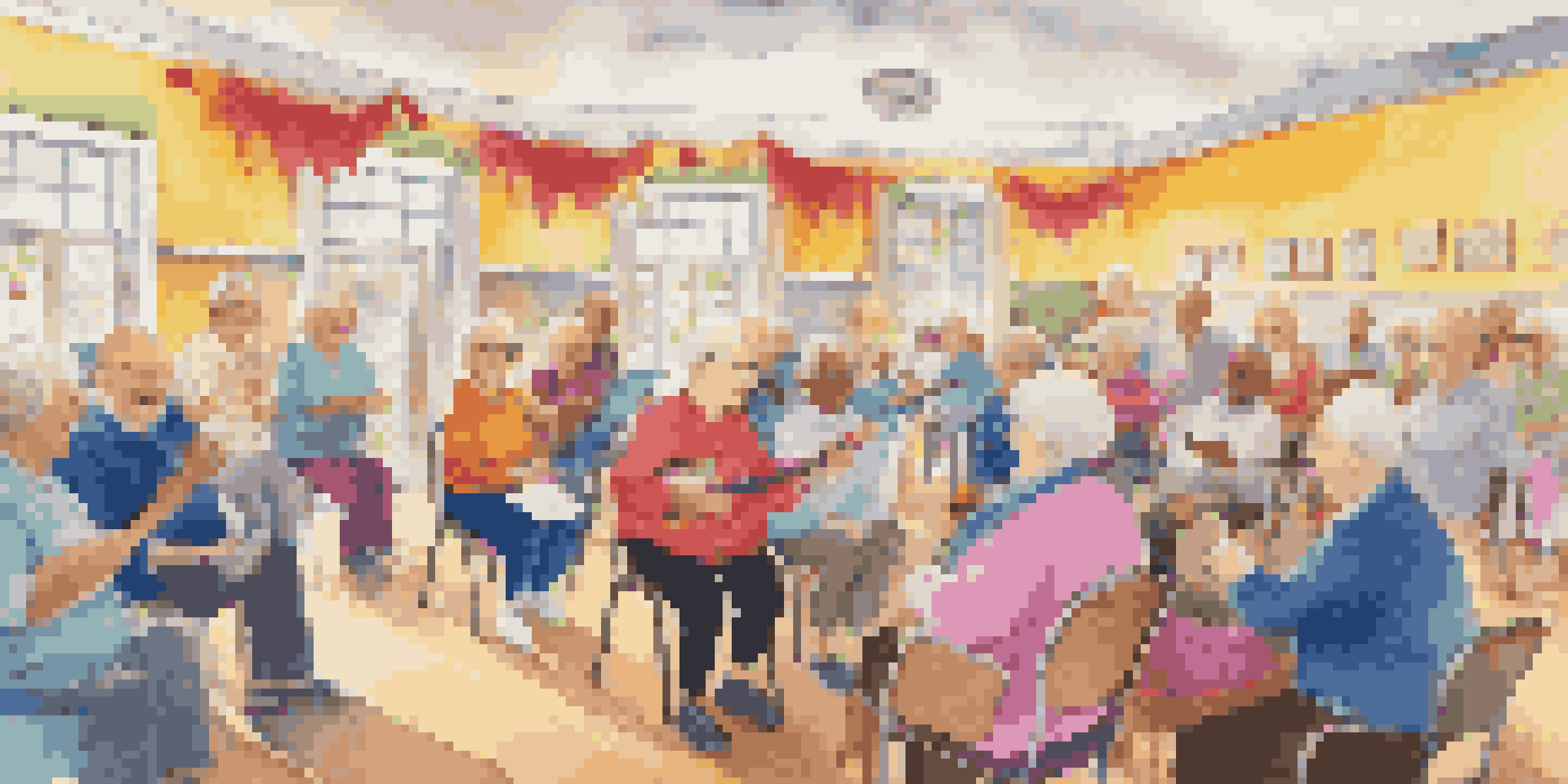 Seniors participating in a joyful sing-along session at a community center, with a piano player and colorful decorations.