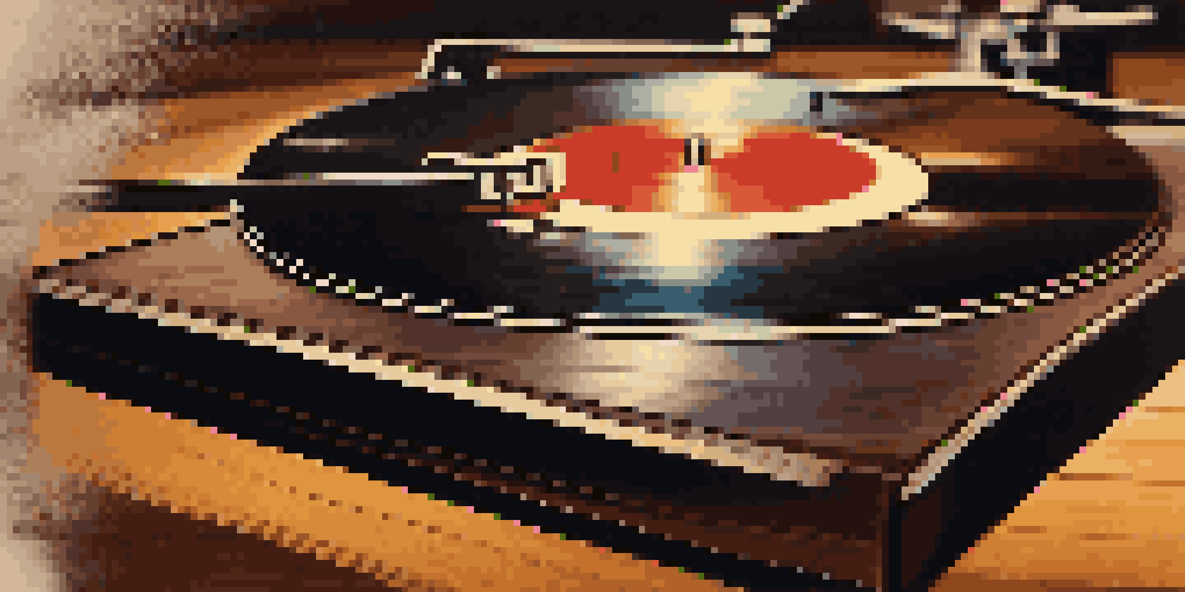 A vintage vinyl record spinning on a turntable with a needle gliding over it, illuminated by soft warm lighting.
