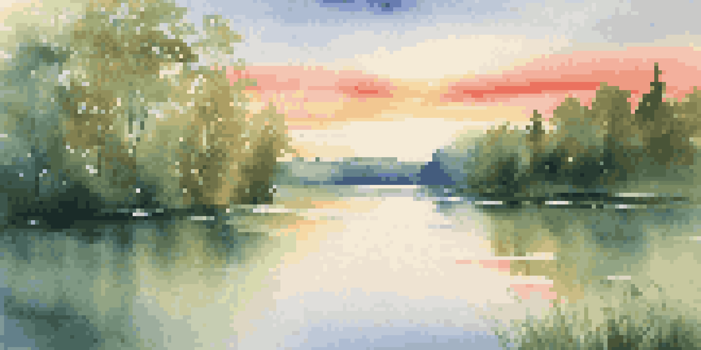 A peaceful lake scene with green forests and a colorful sunset reflected on the water.