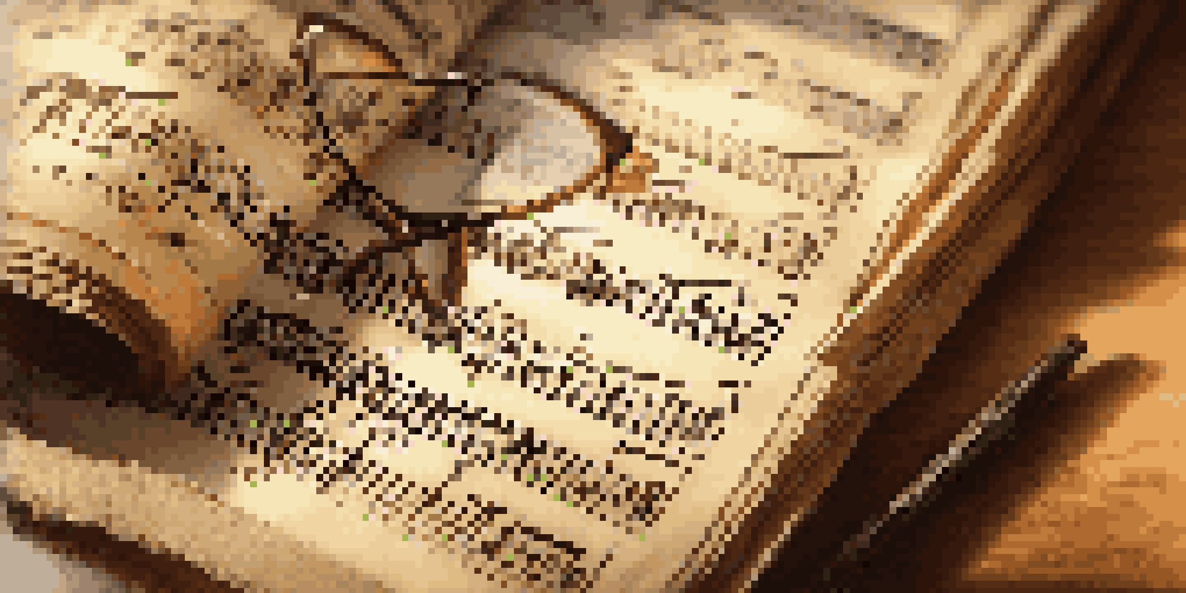 A close-up view of a vintage musical score on a wooden table, with notes and symbols visible, accompanied by glasses.
