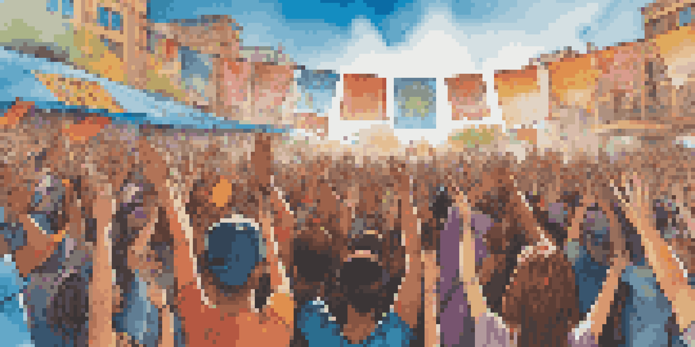 A lively music festival with a diverse crowd celebrating unity and social justice, featuring colorful banners and artists on stage.