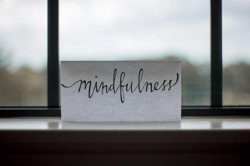 mindfullness printed paper near window