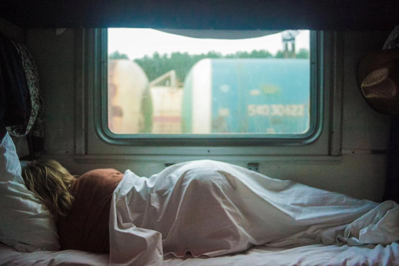 woman sleeping in trailer