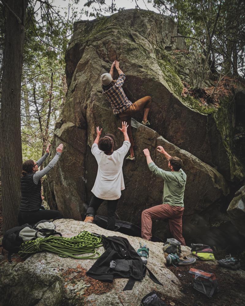 group of people rock climbing