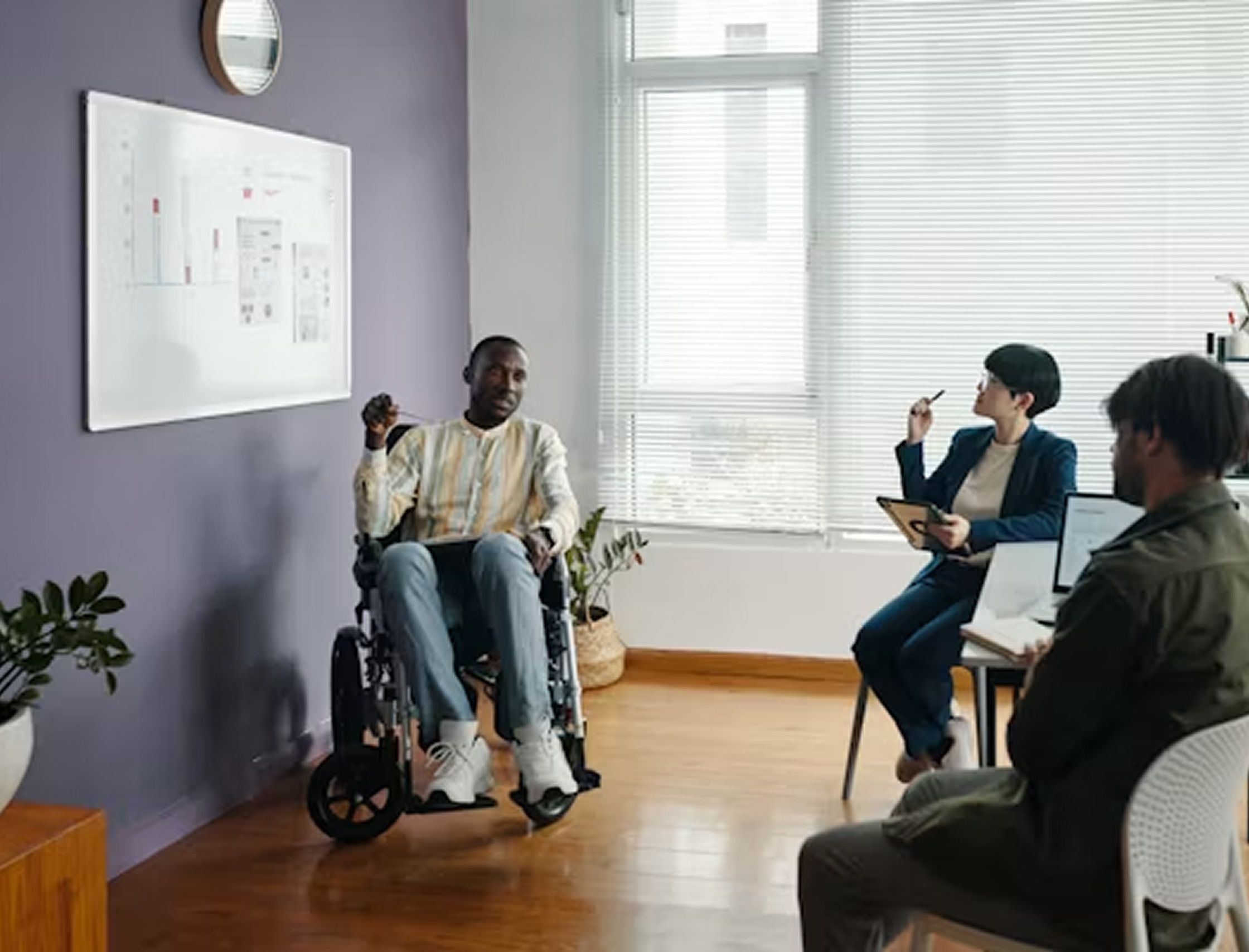 Diverse corporate team collaborating during an inclusive workplace training session