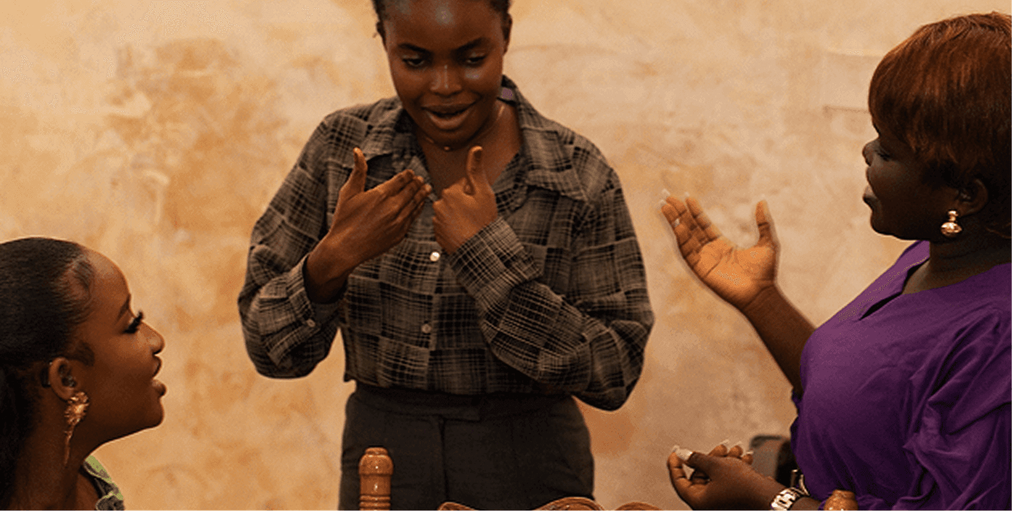 Two women communicating using sign language