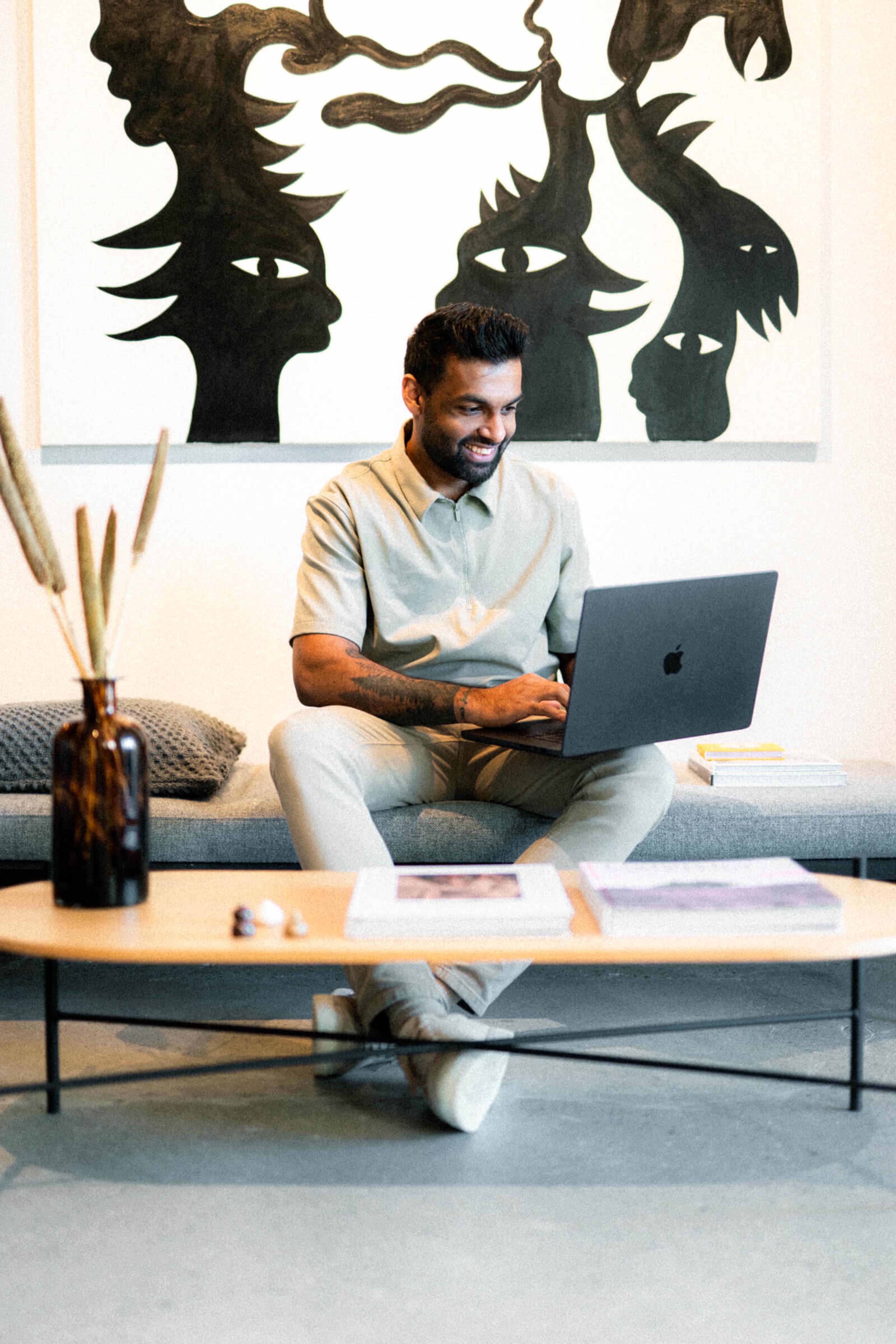 Kiranan Luxmy, CEO of Grafikr, working from a daybed
