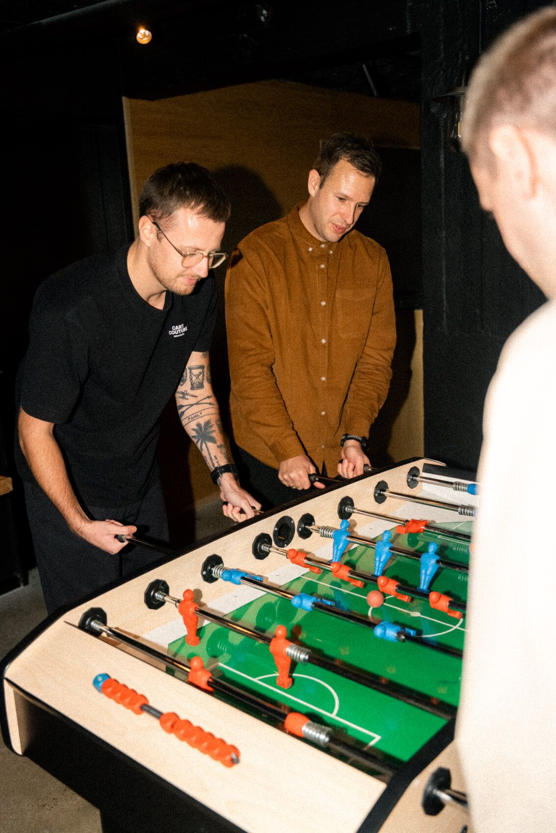 Grafikr Team playing table soccer