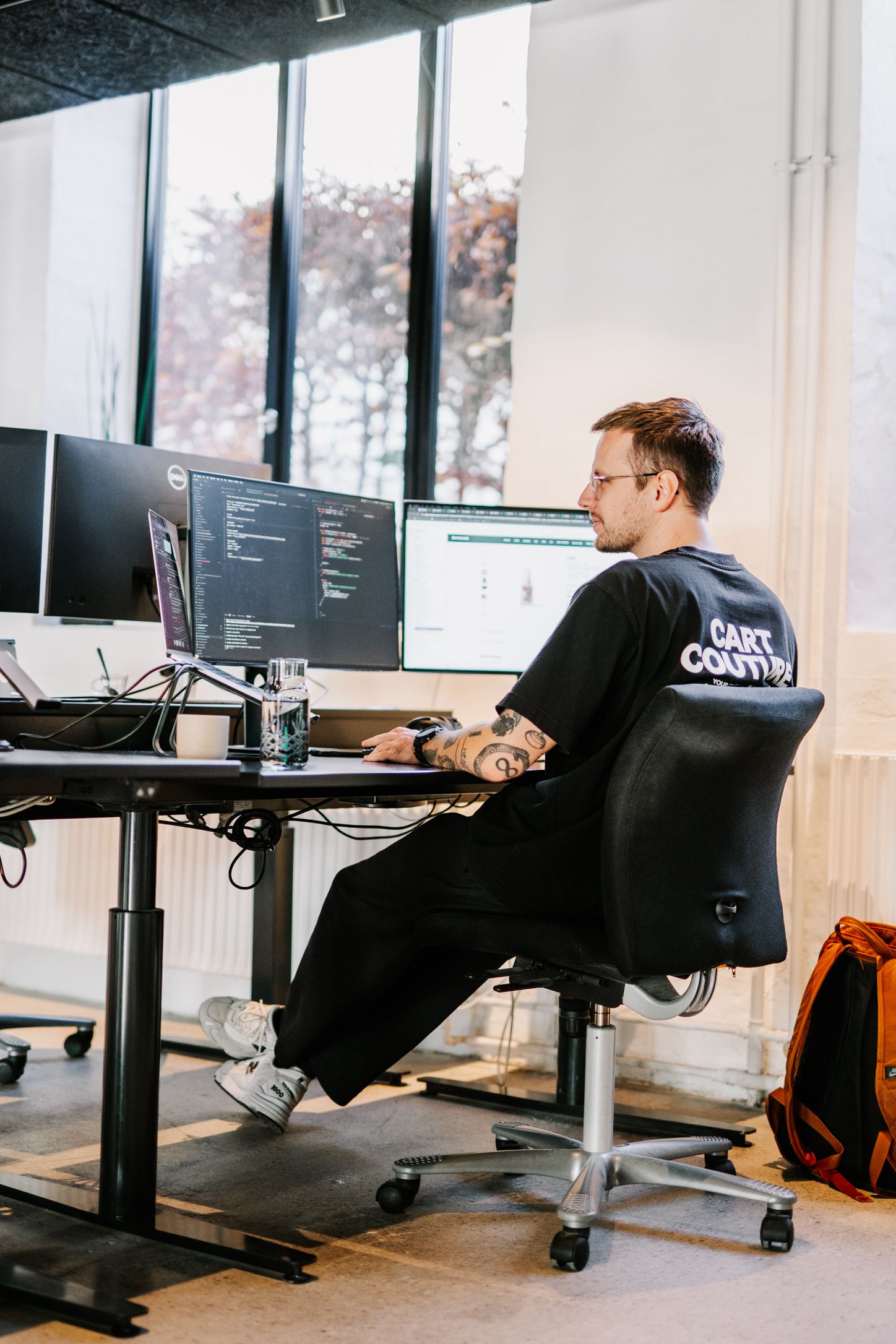 developer from Grafikr wearing Grafikr merchandise t-shirt