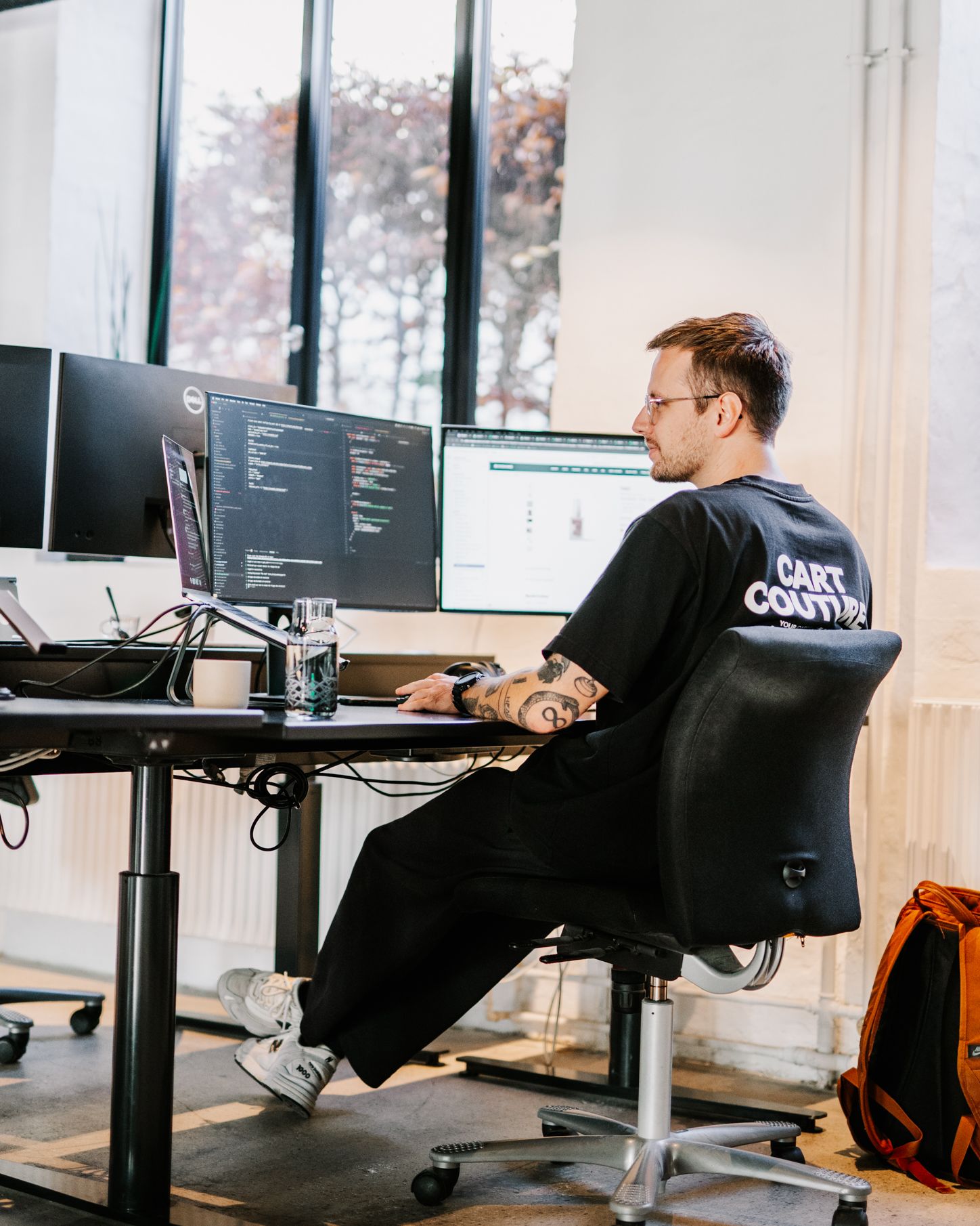 developer from Grafikr wearing Grafikr merchandise t-shirt