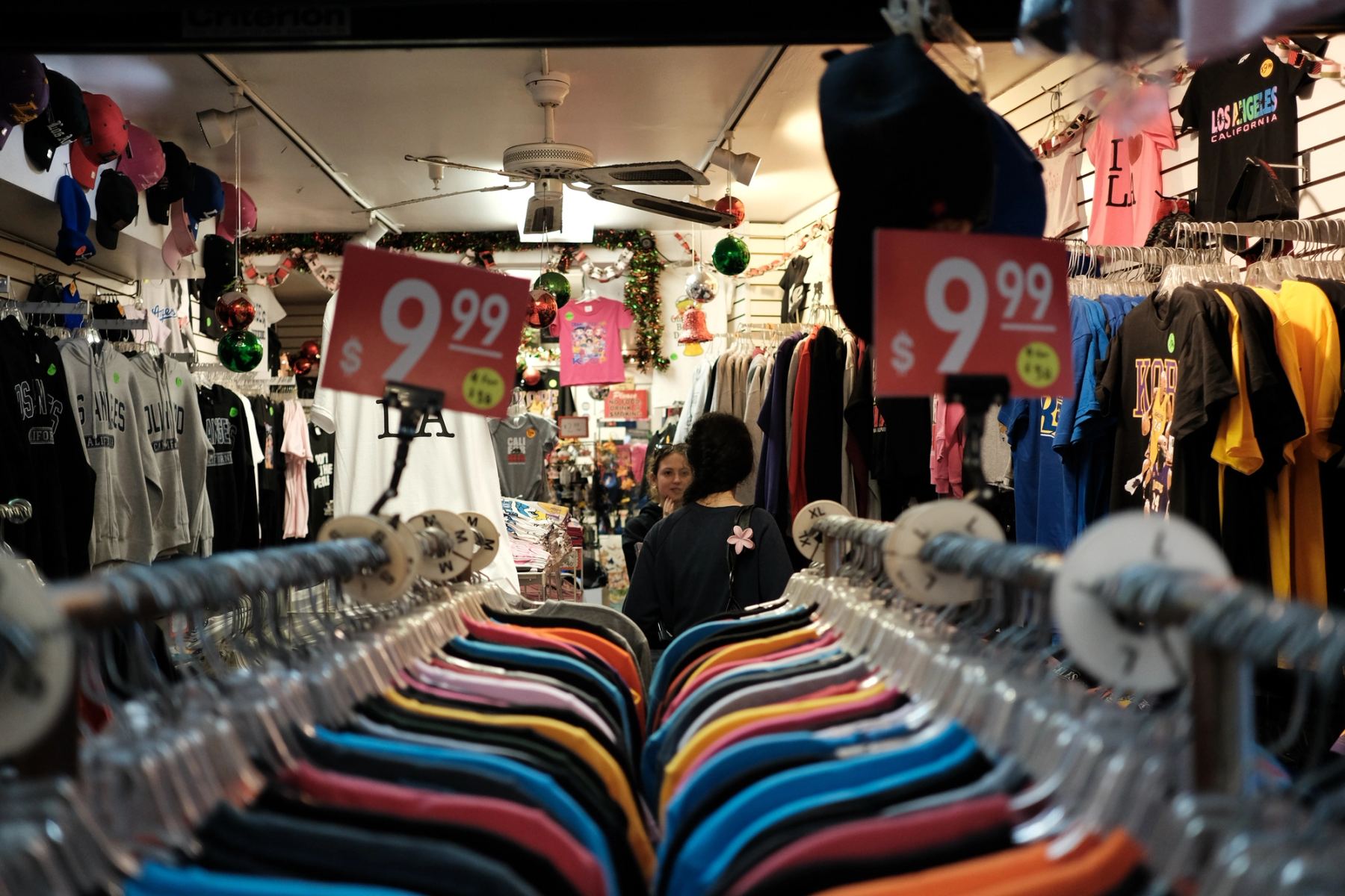 Two people talking in a clothing shop
