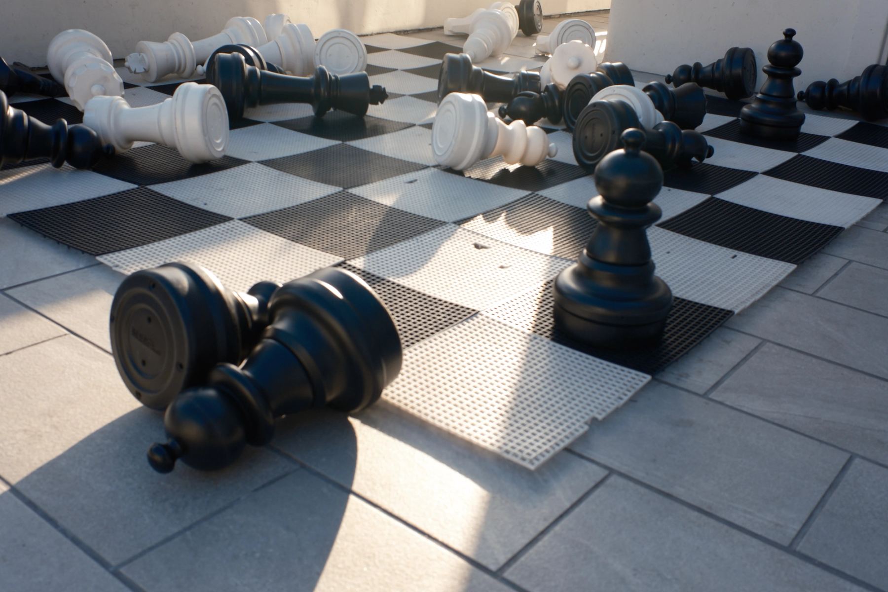 Big chess plate with chess falling down
