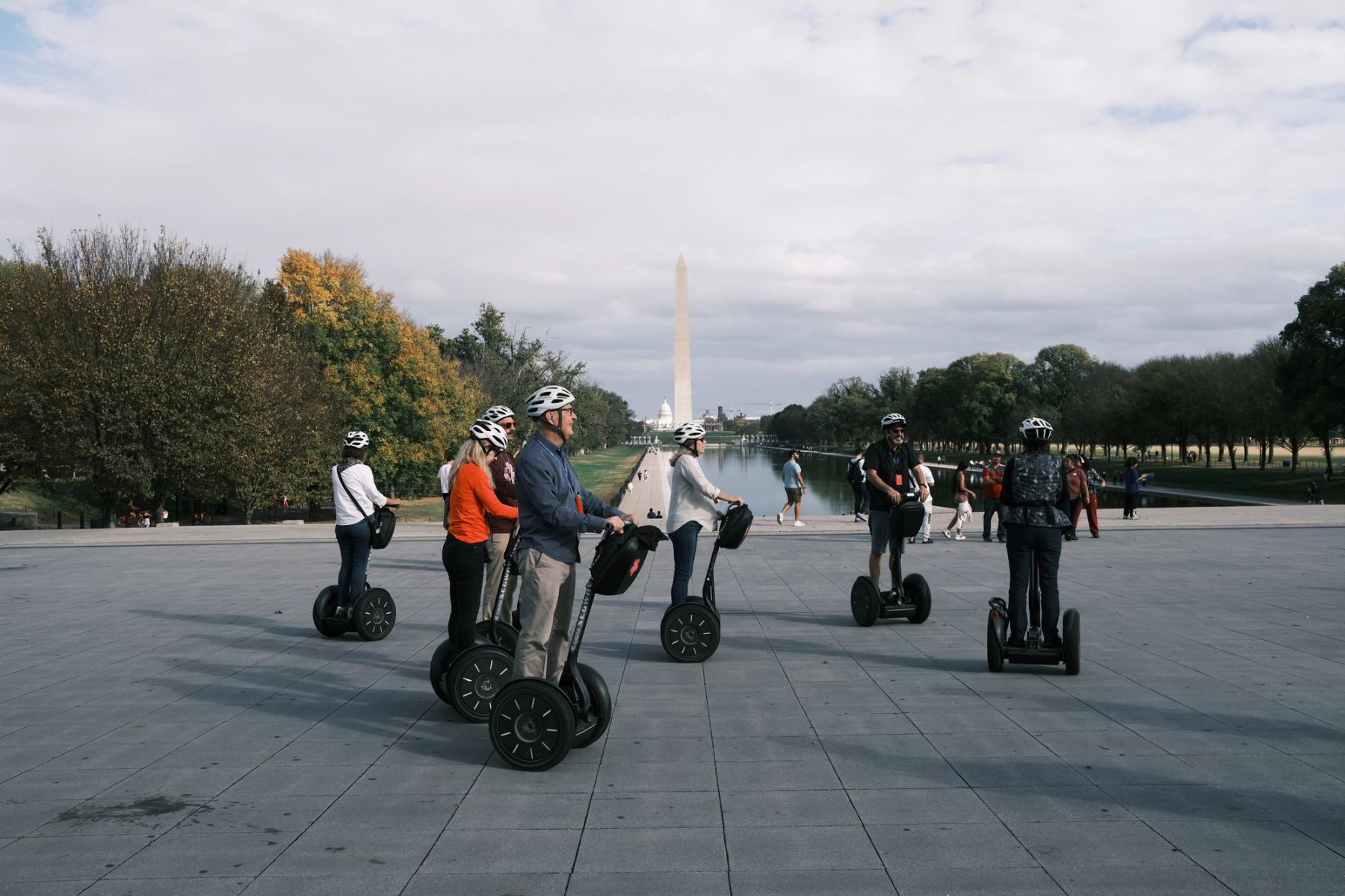 People riding scooters